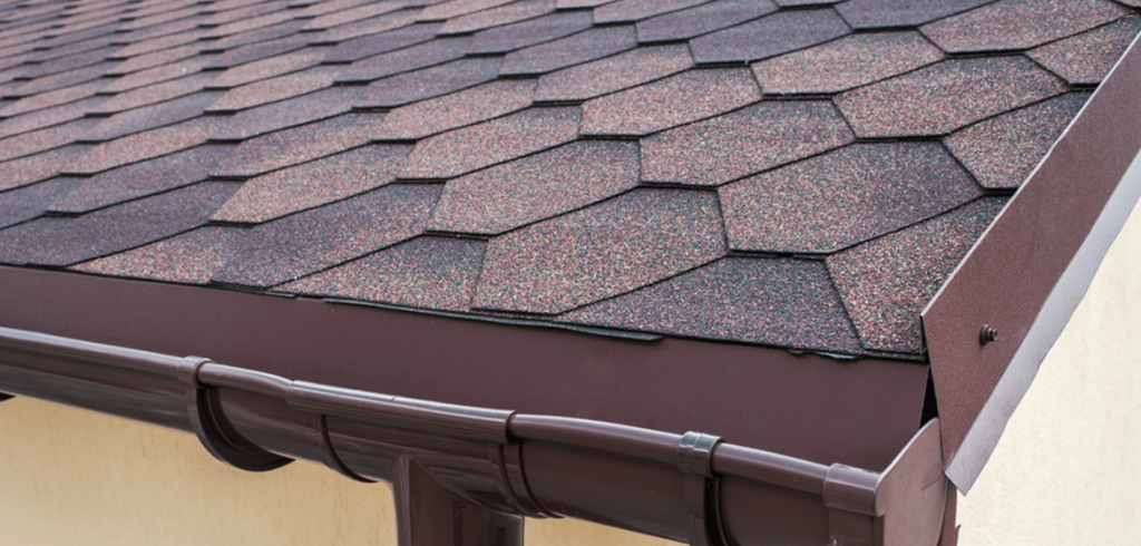 A brown roof and gutter on a home in Dallas, TX
